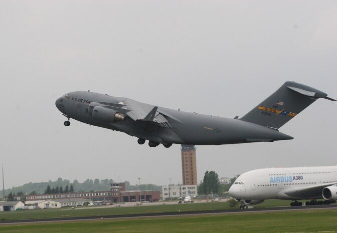 BERLIN, Germany - "The Spirit of Berlin" C-17 Globemaster III takes off May 16 for a flight demonstration at the Berlin Air Show. The C-17 from Charleston Air Force Base, S.C., and other Air Force and Army aircraft are attending the air show at Berlin-Schoenefeld Airport May 16-21. The Berlin Air Show is one of the premier events of its type in the world, and U.S. military participation contributes to a number of U.S. security and foreign policy interests. Participation promotes standardization and interoperability of equipment with our NATO allies and other potential coalition partners, highlights the strength of the U.S. commitment to the security of Europe and demonstrates that U.S. industry is producing equipment that will be critical to the success of current and future military operations. (Photo by Maj. Pamela A.Q. Cook, USAF)
