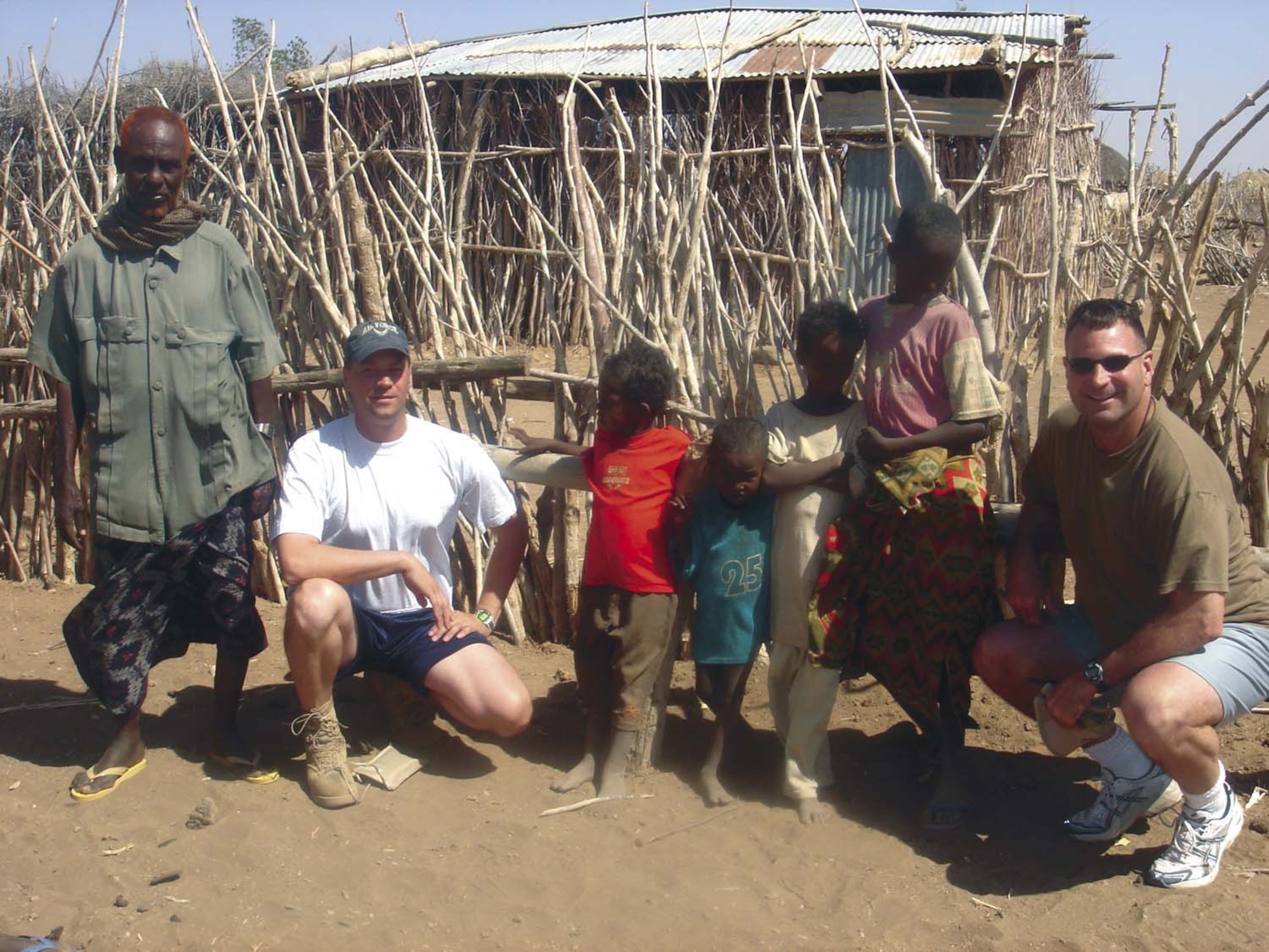 Members of the 746th AEW pose with some of their new friends in Ethiopia. (Maj. Ann Peru Knabe)                              