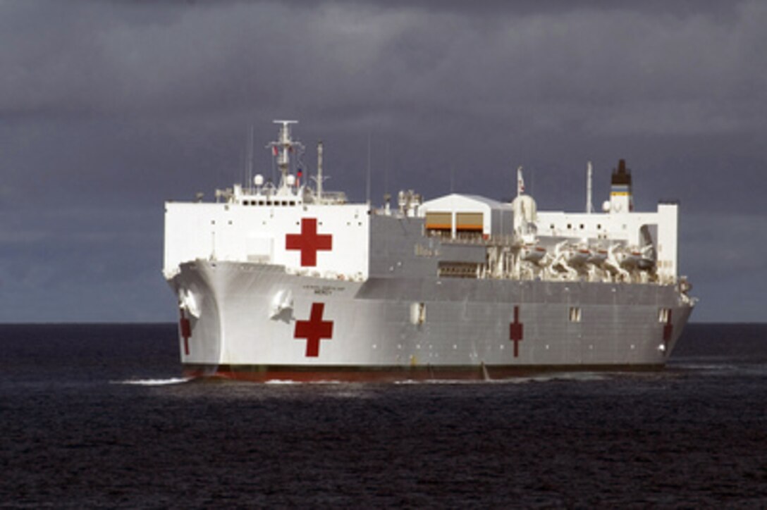 The Military Sealift Command hospital ship USNS Mercy (T-AH 19) navigates through Apra Harbor, Guam, on May 15, 2006. The Mercy is on a five-month deployment to areas of Southeast Asia and the Pacific Islands to join with health and civic organizations to provide humanitarian assistance and conduct community improvement projects. 