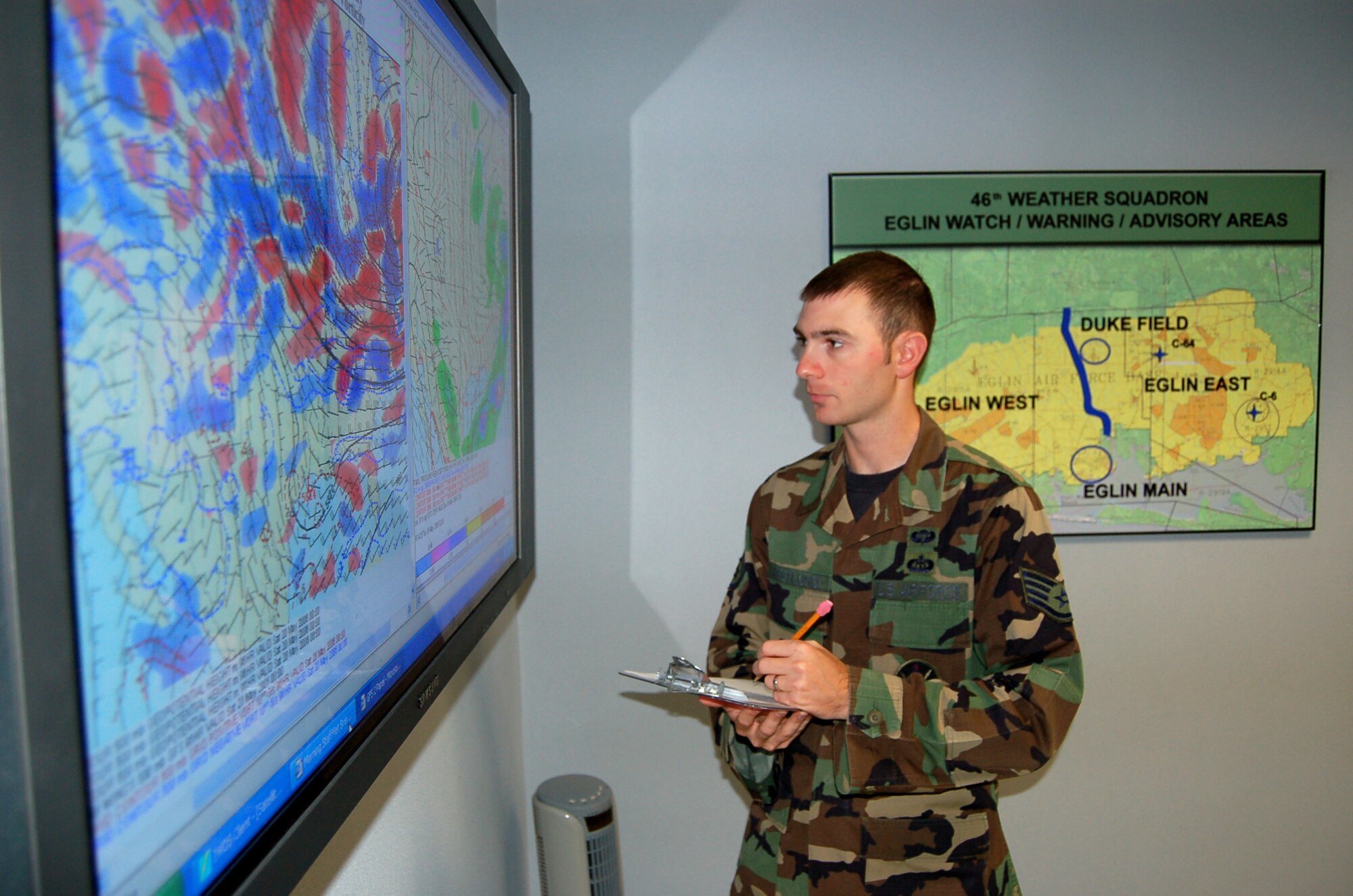 Weather forecaster Staff Sgt. Mitchell Westlund takes part in a hurricane response exercise hurricane at Eglin Air Force Base, Fla., on Wednesday, May 17, 2006. The 46th Weather Squadron troop said indications are this will be an above average season for storms and that it would be a mistake to take hurricane preparations lightly. With the season right around the corner, from June through November, Eglin held a three-day exercise May 15 through May 17, called "Hurricane Lisette," to prepare for the next big storm. (U.S. Air Force photo/Master Sgt. Timothy P. Barela)