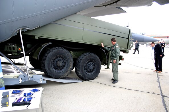 Master Sgt. Ronnie Klipp guides a Medium Extended Air Defense System onto a C-130J Hercules during a demonstration of the aircraft's interoperability the Berlin Air Show.  Various models of U.S. military aircraft and about 60 support personnel from bases in Europe and the United States are attending the air show at Berlin-Schoenefeld Airport May 16-21.  Sergeant Klipp is a crew chief assigned to the 403rd Aircraft Maintenance Squadron at Keesler Air Force Base, Miss.  (U.S. Air Force photo/Wolfgang Hofmann)