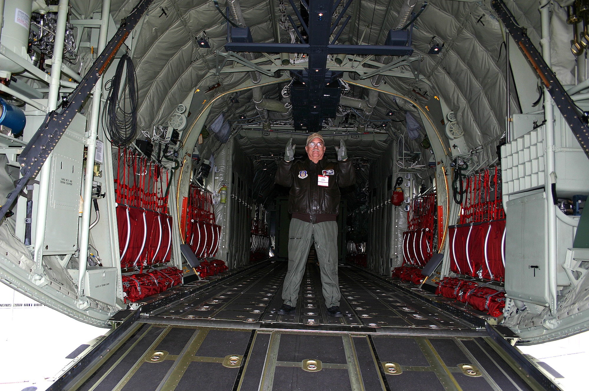 Chief Master Sgt. Michael Scaffidi guides a Medium Extended Air Defense System onto a C-130J Hercules during a demonstration of the aircraft's interoperability at the Berlin Air Show.  Various models of U.S. military aircraft and about 60 support personnel from bases in Europe and the United States are attending the air show at Berlin-Schoenefeld Airport May 16-21.  Chief Scaffidi is a loadmaster assigned to the 53rd Weather Reconnaissance Squadron at Keesler Air Force Base, Miss.  (U.S. Air Force photo/Wolfgang Hofmann) 