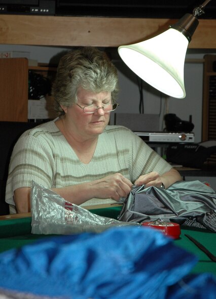 Wendy Schilling, 512th Airlift Wing Spouses Group member and wife of Retired Chief Master Sgt. Jim Schilling, formerly with the 512th Equipment Maintenance Squadron at Dover Air Force Base, was one of eight women who altered  40 shorts May 15 as part of the project Sew Much Comfort. The 512th Airlift Wing is a unit of the Air Force Reserve Command.