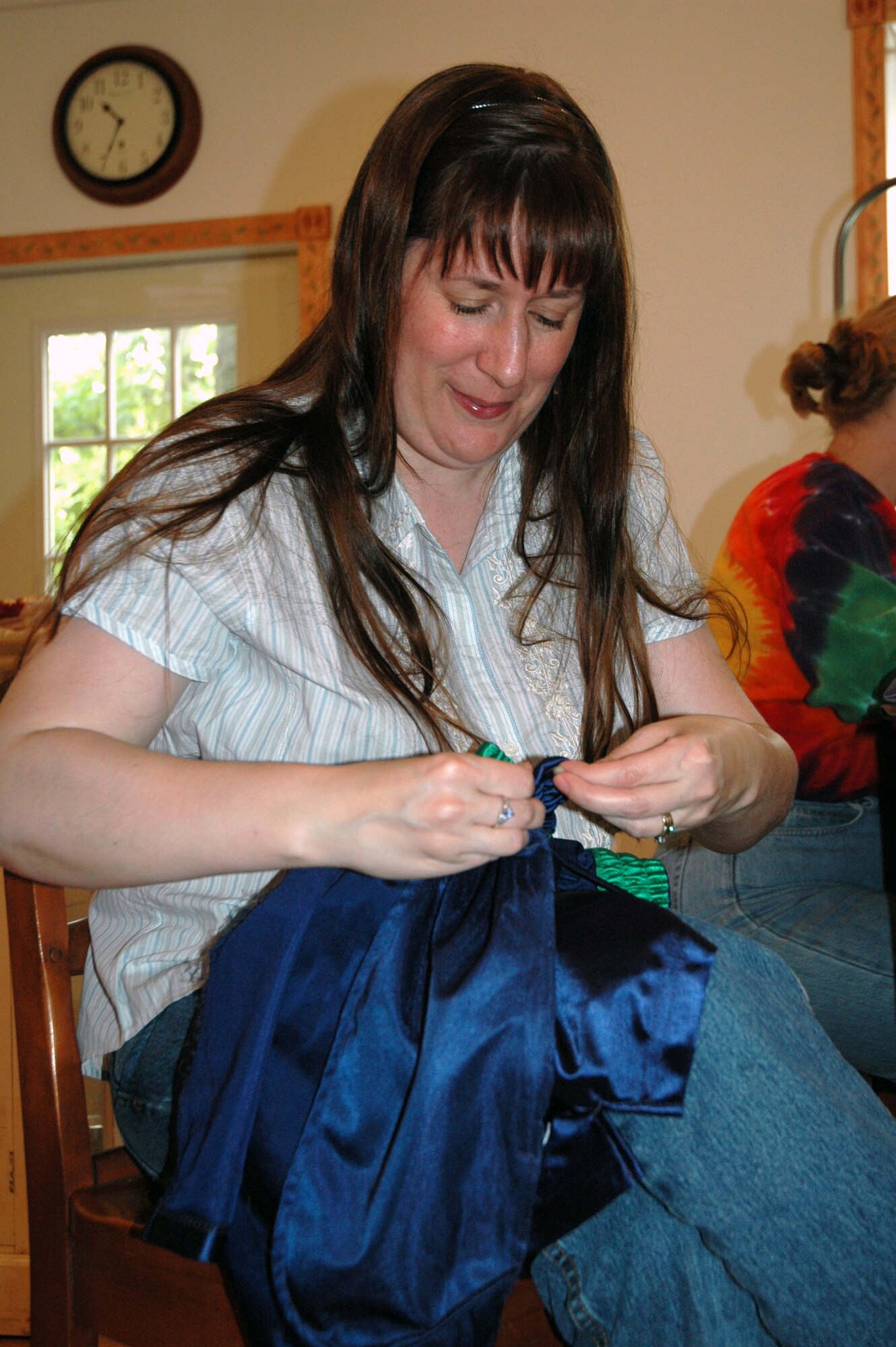 Kim McIntyre-Bott, 512th Airlift Wing Spouses Group member and wife of Maj. Roger Bott of the 326th Airlift Squadron at Dover Air Force Base, was one of eight women who altered  40 shorts as part of the project Sew Much Comfort May 15.