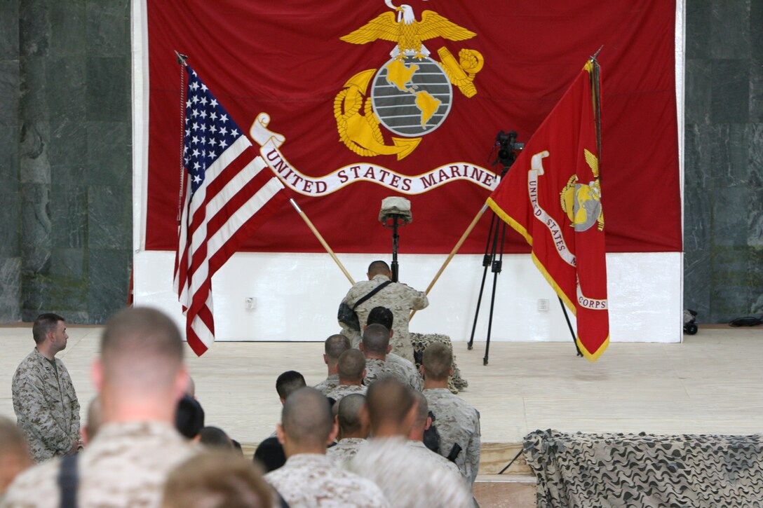 A line of Marines and sailors wait to pay last respects to Lance Cpl. Leon B. Deraps, a combat engineer with Company C, Combat Logistics Battalion 5, who was killed by an improvised explosive device on May 6, 2006 while providing engineering support in the Al Anbar Province. Deraps, a native of Jamestown, Mo., was considered a kind-hearted and caring friend, one who put everyone ahead of himself. His awards include the Purple Heat, National Defense Service Medal, the Global War on Terrorism Service Medal, and the Iraqi Campaign Medal.