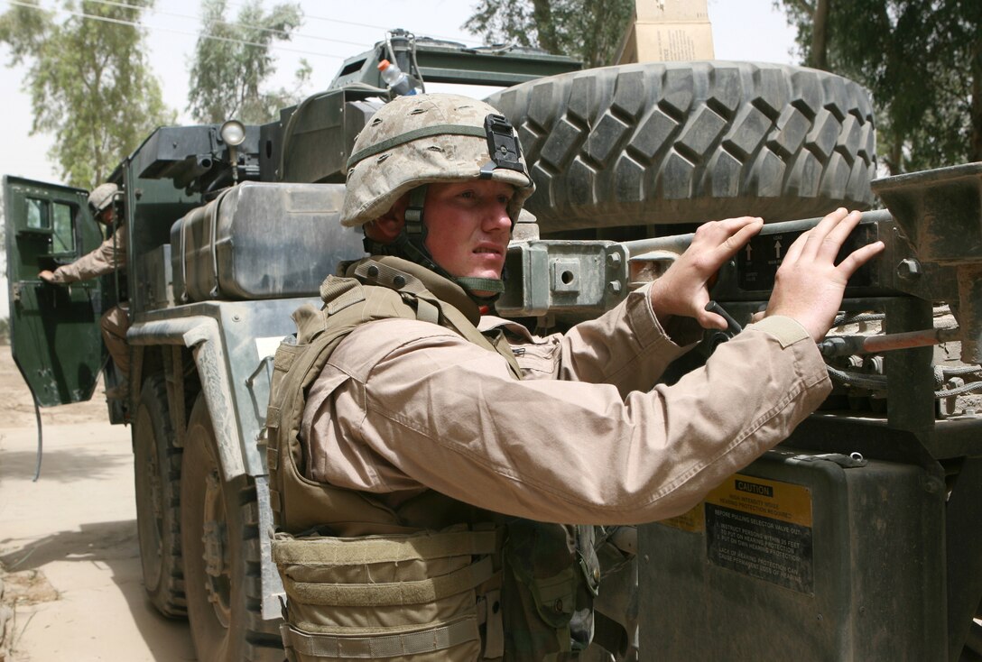 It?s no easy task managing a high-volume container full of food or the equipment that moves it. On May 17, 2006, Lance Cpl. Chad J. Anderson, a 22-year-old native of Superior, Wisc., does just that as he and the rest of 3rd Platoon conducted a supply convoy for Marines serving with Iraqi Security Forces on the outskirts of Fallujah, Iraq. Since arriving in late February, the Marines have conducted more than 42 convoys, averaging one every other day. Most convoys here are supply orientated, delivering much needed food and equipment to Marines spread throughout the region.