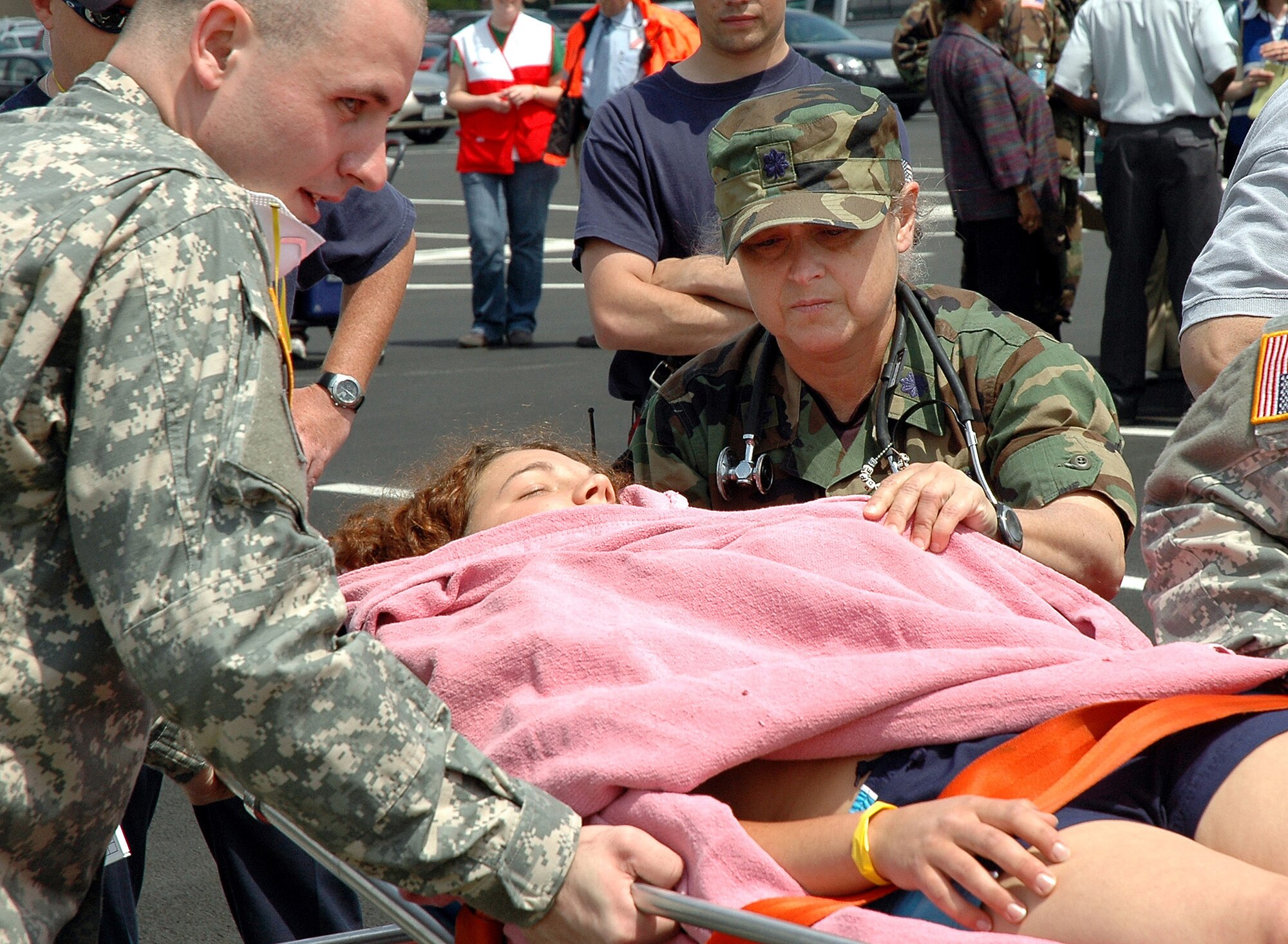 Lt. Col. (Dr.) Marilyn D. Perry checks on a "victim" of an anthrax attack during an exercise at the Pentagon on Wednesday, May 17, 2006.  Dr. Perry acted as the on-scene medical director for the exercise.  During exercise Gallant Fox 06, officials from Washington D.C. area fire, emergency medical service, and police departments; military members; and members of the Pentagon Force Protection Agency participated in the exercise, which included decontamination and medical processing of victims of a simulated anthrax attack at the Pentagon.  (U.S. Air Force photo/Staff Sgt. C. Todd Lopez)