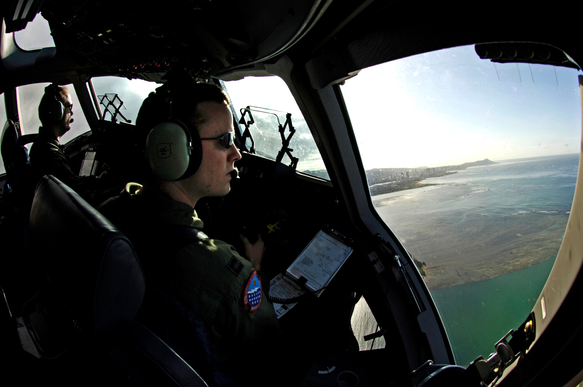 Capt. Jason Mills and Maj. Matthew Zehr take off from Hickam Air Force Base, Hawaii May 16, 2006, for an airdrop training mission. Captain Mills and Major Zehr are from the 535th Airlift Squadron. The training provides multi-element training for the pilots enables users to get larger amounts of equipment in a short period of time and maintains aircrew proficiency. (U.S. Air Force photo/Tech. Sgt. Shane A. Cuomo) 
