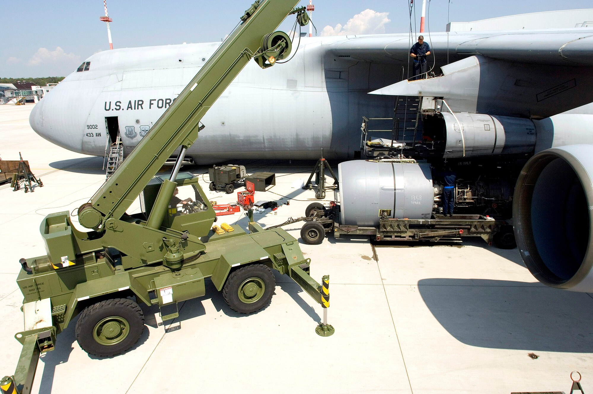 Maintainers from the 723rd Air Mobility Squadron prepare to mount an engine on a C-5 Galaxy on May 12, 2006, at Ramstein Air Base Germany.  (U.S. Air Force photo/Master Sgt. John E. Lasky)
