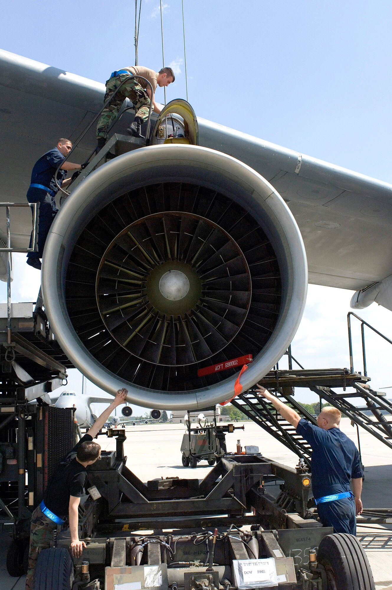 Maintainers line up a jet engine in order to mount it on a C-5 Galaxy on May 12, 2006, at Ramstein Air Base, Germany.  The Airmen are with the 723rd Air Mobility Squadron.  (U.S. Air Force photo/Master Sgt. John E. Lasky)