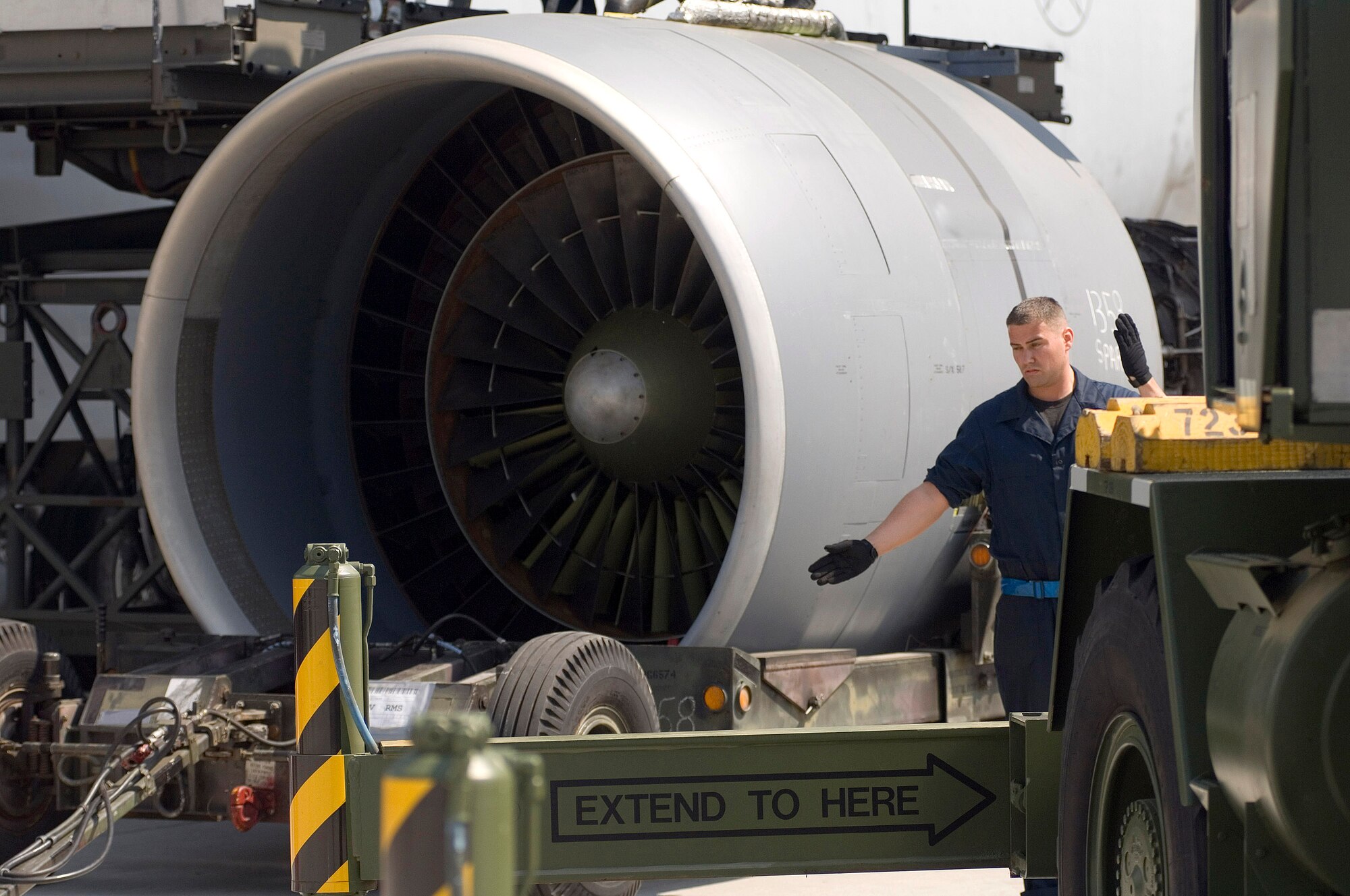 Staff Sgt. Sean Donovan directs a crane into position while preparing to mount an engine on a C-5 Galaxy on May 12, 2006, at Ramstein Air Base Germany.  Sergeant Donovan is a jet engine mechanic assigned to the 723rd Air Mobility Squadron. (U.S. Air Force photo/Master Sgt. John E. Lasky) 
