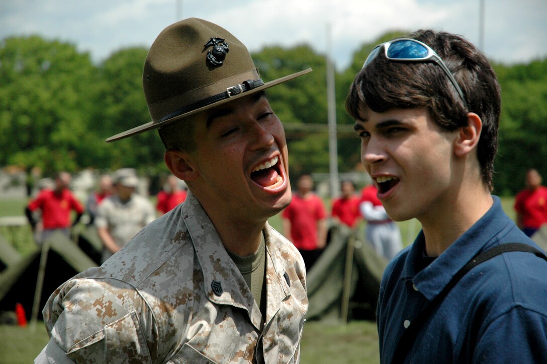 Staff Sgt. John Mast, a drill instructor on weekend loan from Recruit Depot Parris Island, S.C., provides a poolee from Recruiting Station New York with a true sense of the recruit training environment. Two drill instructors prowled the playing field, looking for the next poolee to chomp on. With no competitions scheduled on the first day of the Cup, the drill instructors had plenty of time to tear through each and every poolee as they made their way to each recruiting