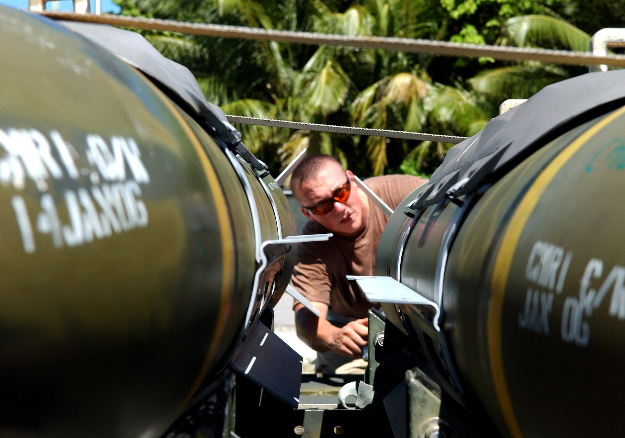 Airman 1st Class Joshua Dunne does a fuse check on a 2,000-pound bomb at a base supporting Operating Enduring Freedom on Wednesday, May 17, 2006. The Airman, of the 40th Air Expeditionary Group, deployed here from Barksdale Air Force Base. (U.S. Air Force photo/Staff Sgt. Patrick Mitchell) 
