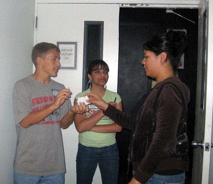 The second Airman’s Night Out – African-American Heritage Night was held Feb. 22 in the teen center. Keystone Club members, Tim English (left) and Natalie Rodriguez-Gil (center), help Airmen navigate through the different rooms that displayed African-American history milestones. (Courtesy Photograph)
