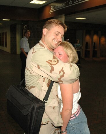 Staff Sergeant Andy Harkleroad, a reservist assigned to the 81st Aerial Port Squadron at Charleston AFB, S.C., greets his girlfriend with a big hug after arriving at the Charleston International Airport from a 4-month deployment in Kuwait.  (Photo by 1st Lt. Wayne Capps)