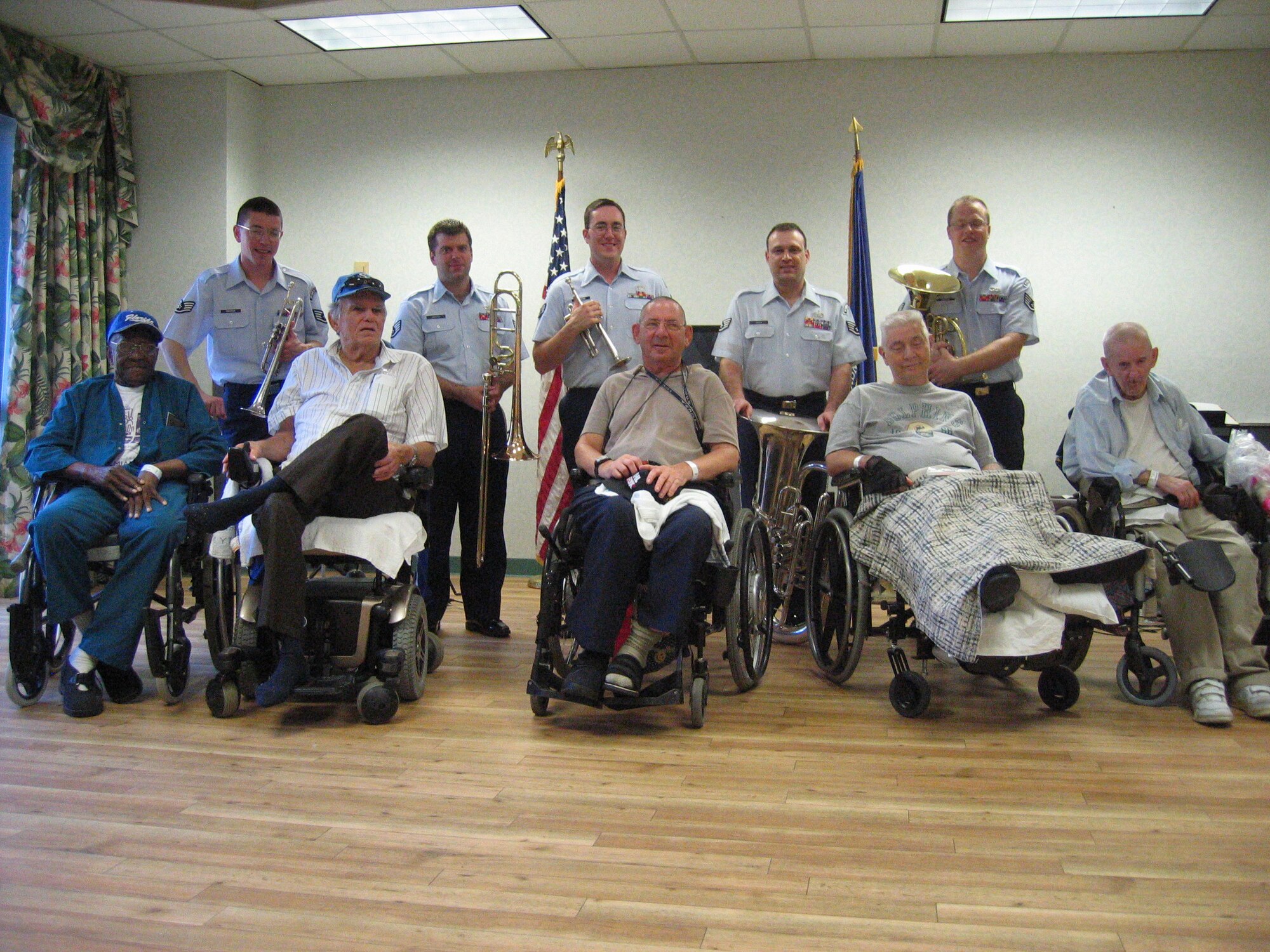 Residents of the Miami, Fla Veterans Administration Retirement Facility spent part of Armed Forces Day afternoon enjoying patriotic music played by the Air Force Reserve Band's Brass Quintet ensemble. Some of the residents took time to have a photo taken with the band. The Band of the Air Force Reserve performed nine times in South Florida as part of a community outreach project.
(Air Force photo by Tech. Sgt. Paul Dean)
