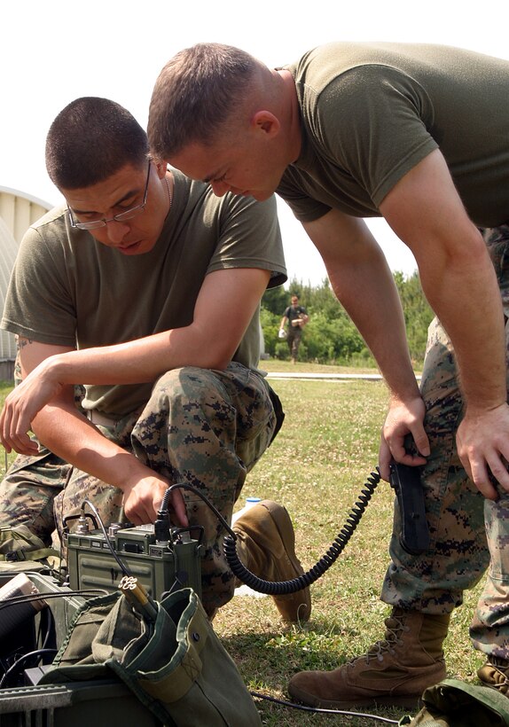Marines of the 26th Marine Expeditionary Unit work to establish communications during a field exercise aboard United States Marine Corps Auxiliary Landing Field, Bogue, N.C., May 22, 2006.  (Official USMC photo by Lance Cpl. Jeremy T. Ross) (Released)
