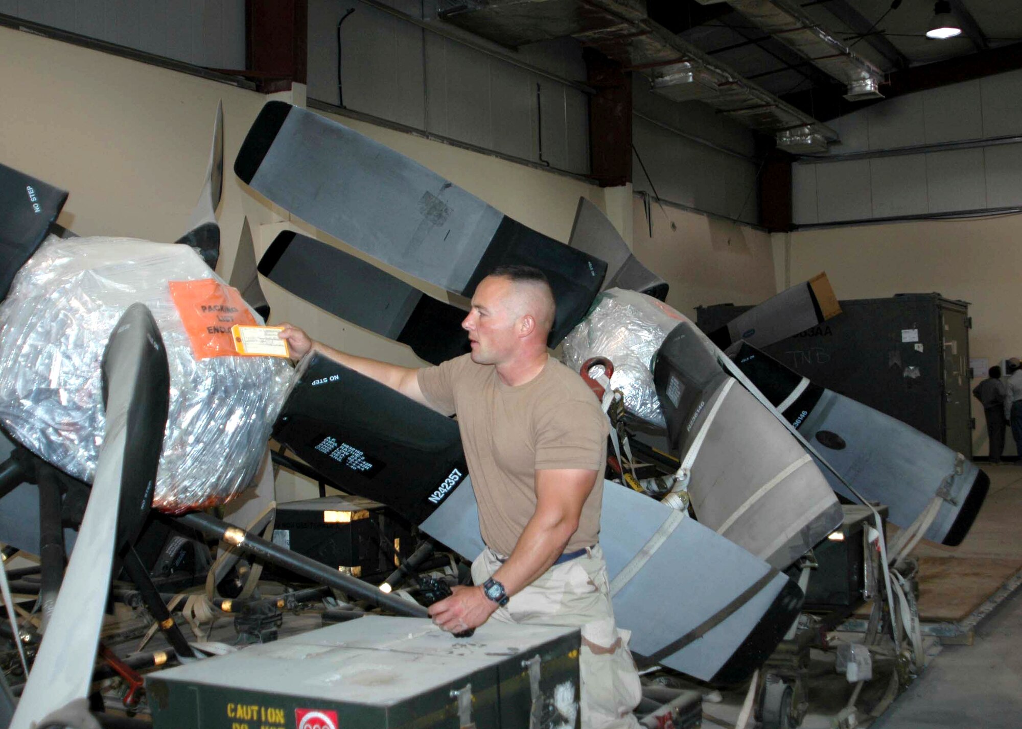 Tech. Sgt. Scott Schlie checks inventory at a new facility that enables aircraft maintainers to repair C-130 Hercules engines and propellers in Southwest Asia.  Sergeant Schlie is a C-130 engine manager and is assigned to the 386th Expeditionary Maintenance Squadron.   He is deployed from Pope Air Force Base, N.C.  (U.S. Air Force photo/Maj. Stephanie Bindemann.) 