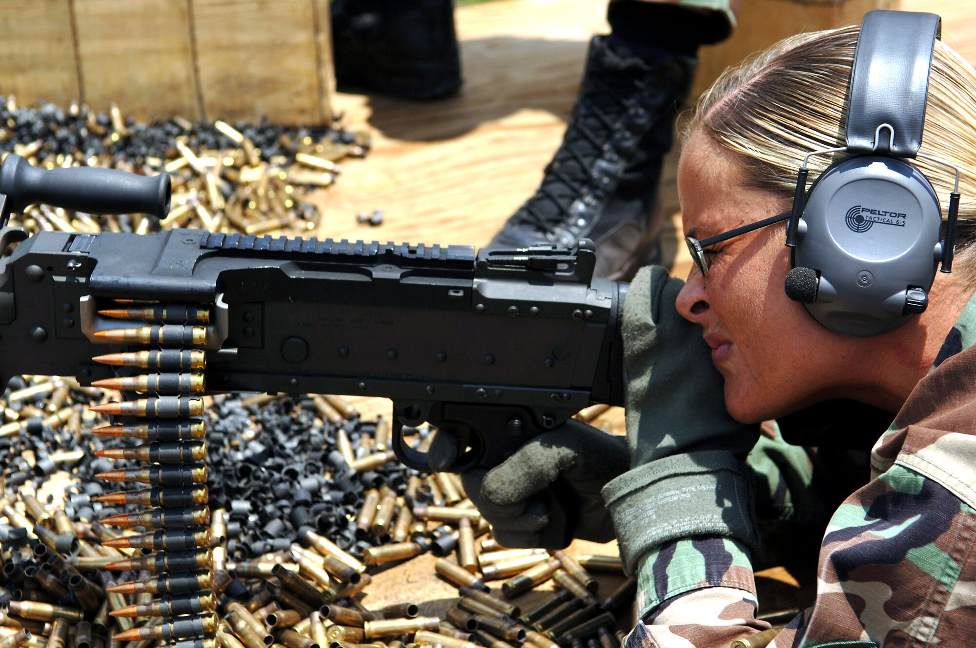 Tech. Sgt. Amy Sobel fires an M240B medium machine gun during a combat arms training and maintenance class at Avon Park Air Force Range, Fla., on Thursday, May 18, 2006.  Sergeant Sobel is a CATM instructor at the range.  Security forces Airmen from the 6th Security Forces Squadron at MacDill Air Force Base, Fla., were at the range to train for upcoming deployments.  (U.S. Air Force photo/Senior Airman Jason P. Robertson)