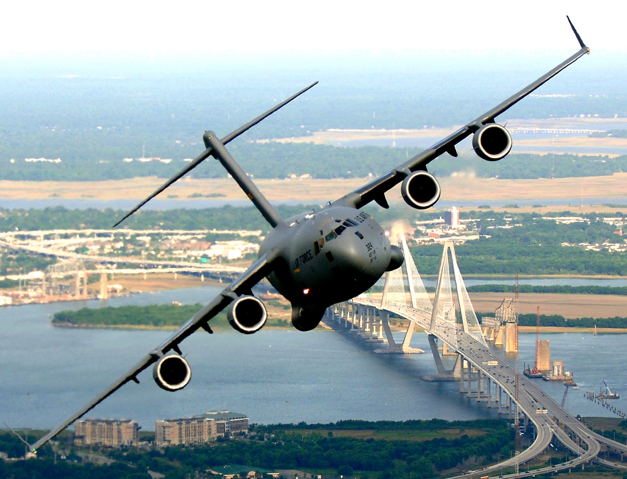 A C-17 Globemaster III from the 14th Airlift Squadron, Charleston Air Force Base, S.C., banks over the Arthur J. Ravenel Bridge in Charleston, S.C., during a training mission on Tuesday, May 16, 2006. (U.S. Air Force photo/Tech. Sgt. Russell E. Cooley IV)