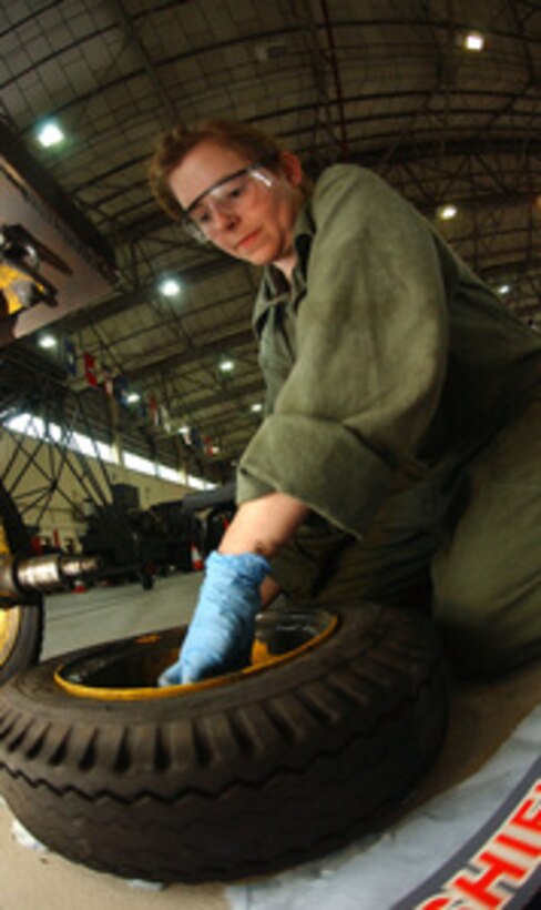 U.S. Air Force Senior Airman Darby Speakman removes wheel bearings from a jack trailer to inspect for dents and cracks during planned maintenance at Royal Air Force Station Mildenhall, England, on May 16, 2006. Speakman is attached to the Aerospace Ground Equipment flight of the 100th Maintenance Squadron. 