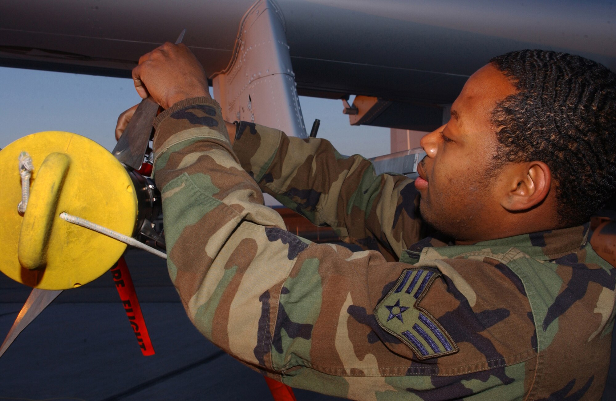 EIELSON AIR FORCE BASE, Alaska - Senior Airman Lane Leroy, weapons loader with the 75th Aircraft Maintenance Unit, Pope Air Force Base, N.C., performs a weapons Post Load on the 75th Fighter Squadron's A-10 Warthog at Red Flag - Alaska. (US Air Force Photo by TSgt Julie Avey)                                                               