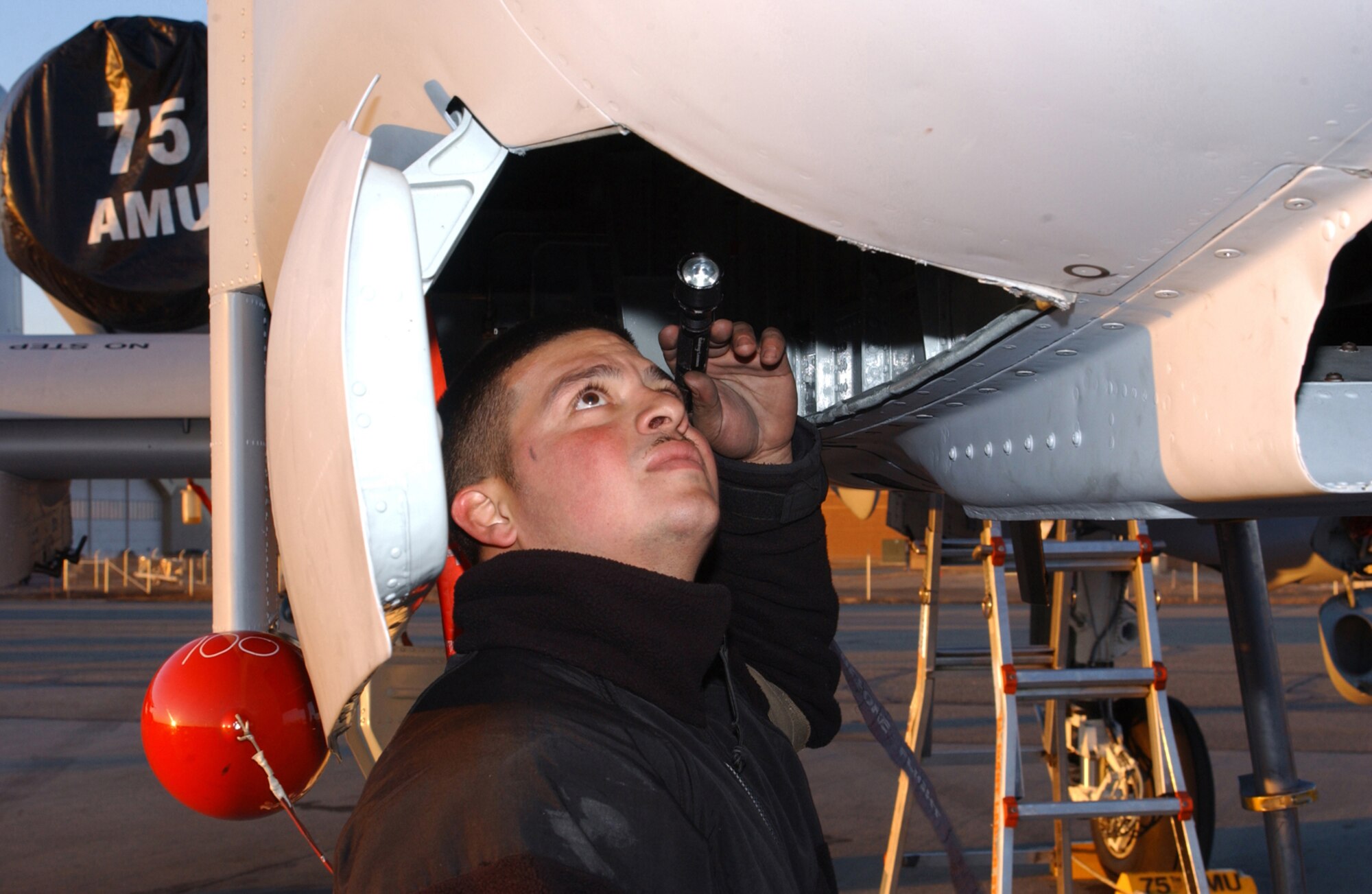 EIELSON AIR FORCE BASE, Alaska - Staff Sergeant Hugo Cordova, Crew Chief with the 75th Fighter Squadron, Pope Air Force Base, North Carolina,  performs post flight inspections on the 75th Fighter Squadron's A-10 Warthog to prepare the plane for tommorw's missions over the Pacific Alaskan Range Complex as a part of  Red Flag - Alaska taking place here until May 5th.  The exercise allows several units, whose missions may differ significantly, the opportunity to work together in a training environment with units with which they may deploy in the future. (US Air Force Photo by TSgt Julie Avey)                                                                                                                      