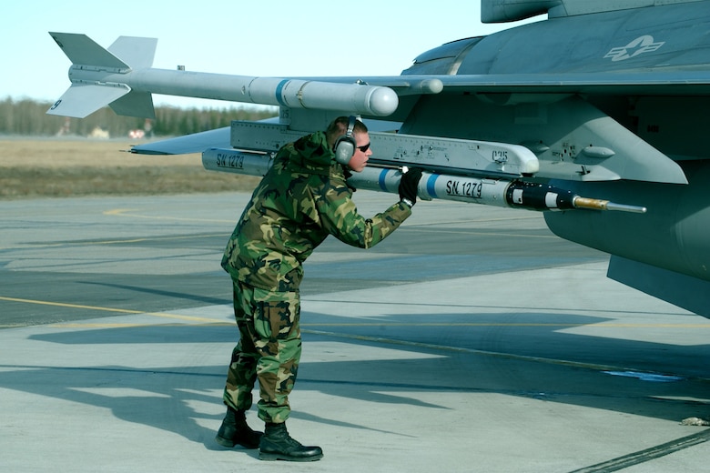EIELSON AIR FORCE BASE, Alaska -- Tech. Sgt. Rick Vandenhoek, weapons loader with the 175th Fighter Squadron, South Dakota Air National Guard, does a final check on the F-16 Fighting Falcon here May 2, 2006 during RED FLAG-Alaska 06-2. Eight ANG F-16s from South Dakota are here for the exercise. (Air Force photo Tech. Sgt. Sara Hilmoe)