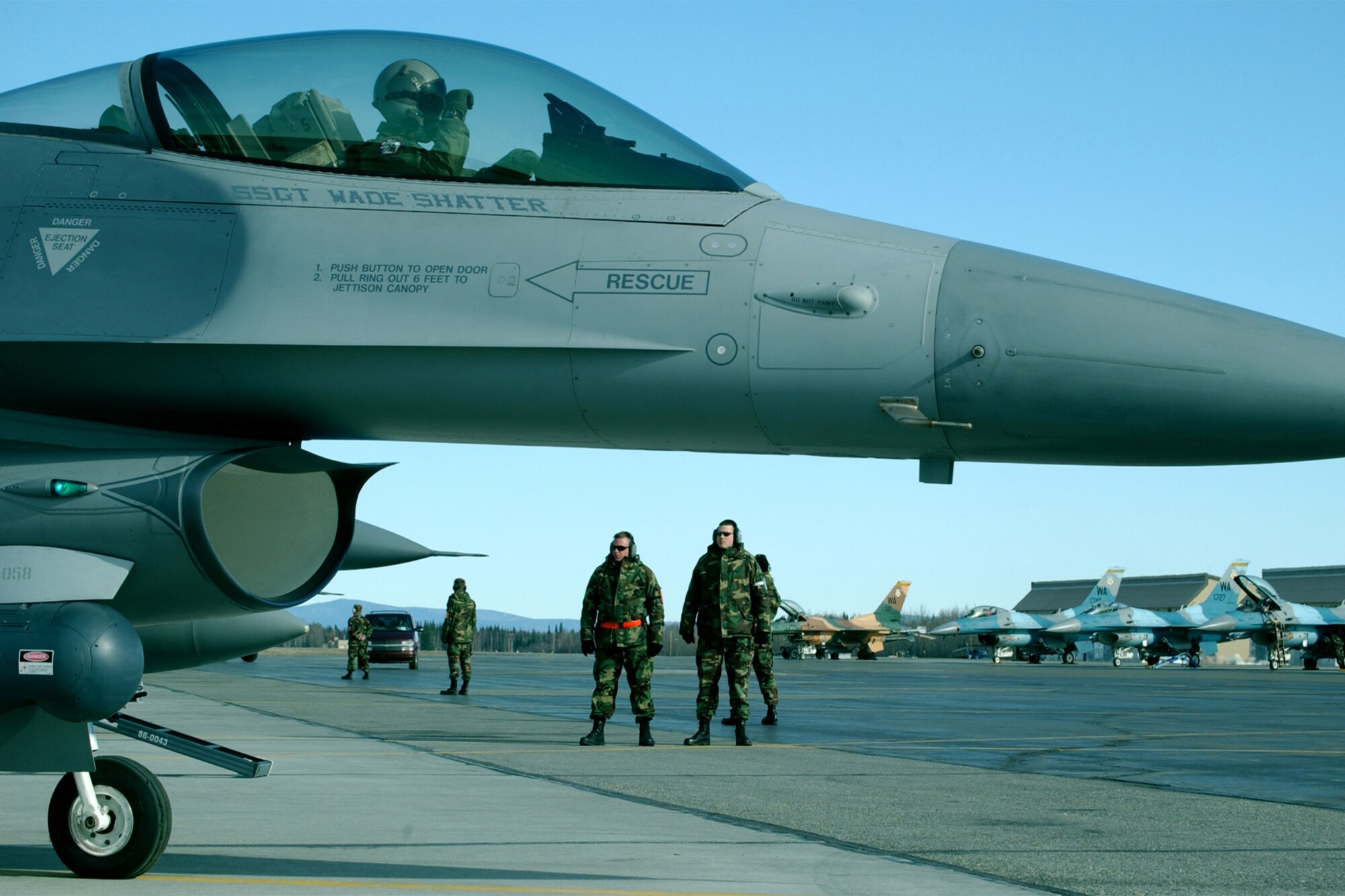 EIELSON AIR FORCE BASE, Alaska -- Crew chiefs from the 175th Fighter Squadron, South Dakota Air National Guard, look on while 2nd Lt. Travis Boltjes, 175th FS pilot, goes through his final checks in his F-16 Fighting Falcon here during RED FLAG-Alaska 06-2 May 2, 2006. (Air Force photo by Tech. Sgt. Sara Hilmoe)