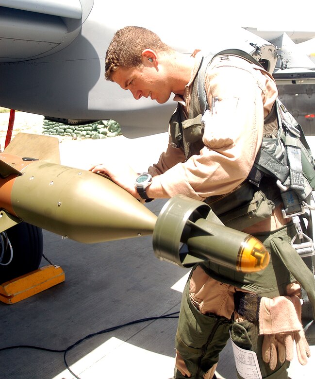Capt. Thomas Kanewske inspects the ordnance on an A-10 Thunderbolt II before taking off on a combat mission from Bagram Air Base, Afghanistan, on Tuesday, May 23, 2006.  Captain Kanewske is deployed to Bagram from Spangdahlem Air Base, Germany, in support of Operation Enduring Freedom. (U.S. Air Force photo/Maj. David Kurle)