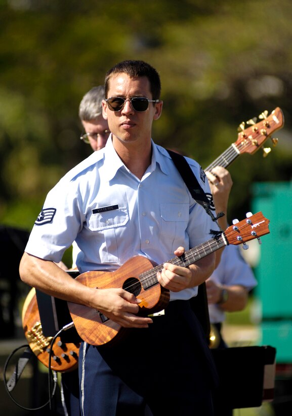 Staff Sgt. John Kukan plays the ukulele during the 10th Annual Twilight Tattoo at Fort DeRussy, Hawaii, on Saturday, May 13, 2006. The event features bands from all the services. (U.S. Air Force photo/Tech. Sgt. Shane A. Cuomo) 
