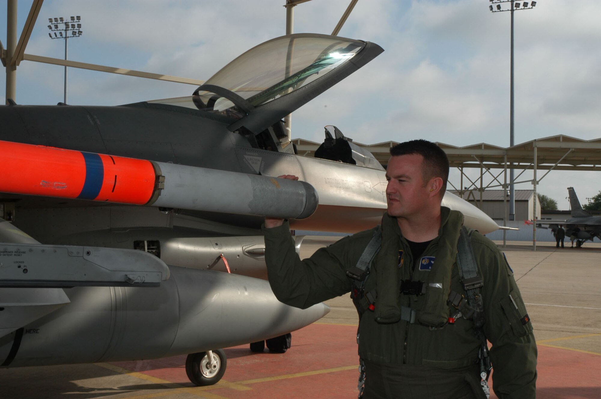 NAVAL AIR STATION JOINT RESERVE BASE, Texas -- Maj. Randy Cason, performs a preflight inspection on a F-16 Fighting Falcon here before takeoff.  Major Cason is assigned to 10th Air Force and is the first Air Force Reservist to be selected to attend F-22 pilot training.  (U.S. Air Force photo/Senior Master Sgt. Bill L. Goben Jr.)                                  