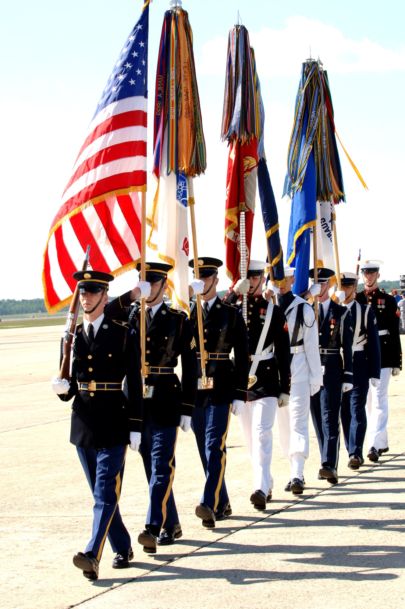 A joint service color guard prepares to post the United States and armed forces flags during the opening ceremony of the 56th annual Department of Defense 2006 Joint Service Open House at Andrews Air Force Base, Md., on Friday, May 19, 2006. The three-day event highlighted American aviators, aircraft and technology. (U.S. Air Force photo/Senior Airman Jeff Andrejcik)