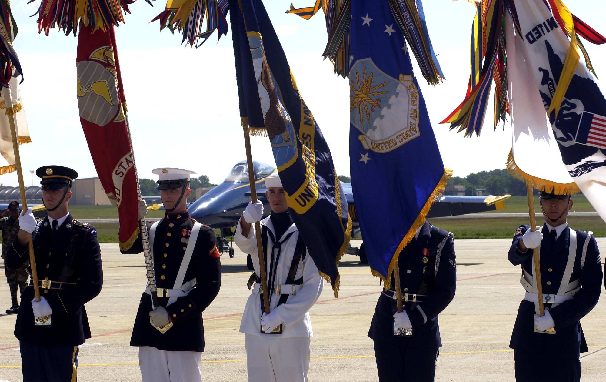 A joint service color guard prepares to post the colors during the opening ceremony of the 56th annual Department of Defense 2006 Joint Service Open House at Andrews Air Force Base, Md., on Friday, May 19, 2006. The three-day event highlighted American aviators, aircraft and technology. (U.S. Air Force photo/Airman 1st Class Nathan R. Arnold)