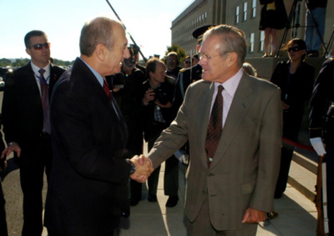 Secretary of Defense Donald H. Rumsfeld welcomes Prime Minister of Israel Ehud Olmert to the Pentagon on May 23, 2006. Olmert is in the U.S. for two days to meet with President George W. Bush and other top government officials as well as address a joint meeting of both chambers of Congress. 