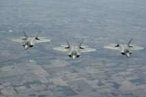 ELMENDORF AIR FORCE BASE, Alaska - F-22s from the 1st Fighter Wing stationed at Langley AFB, Va. fly to Elmendorf AFB Alaska on 23 May 2006.  The 7.5 hour transit was the longest continuous deployment of F-22s as 12 Raptors will participate in Exercise Northern Edge which is slated in June as a joint exercise under the control of Pacific Command. (Photo by Paul Weatherman)