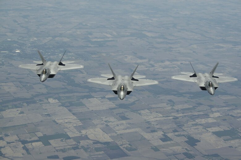 ELMENDORF AIR FORCE BASE, Alaska - F-22s from the 1st Fighter Wing stationed at Langley AFB, Va. fly to Elmendorf AFB Alaska on 23 May 2006.  The 7.5 hour transit was the longest continuous deployment of F-22s as 12 Raptors will participate in Exercise Northern Edge which is slated in June as a joint exercise under the control of Pacific Command. (Photo by Paul Weatherman)