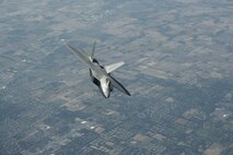 ELMENDORF AIR FORCE BASE, Alaska - F-22s from the 1st Fighter Wing stationed at Langley AFB, Va. fly to Elmendorf AFB Alaska on 23 May 2006.  The 7.5 hour transit was the longest continuous deployment of F-22s as 12 Raptors will participate in Exercise Northern Edge which is slated in June as a joint exercise under the control of Pacific Command. (Photo by Paul Weatherman)