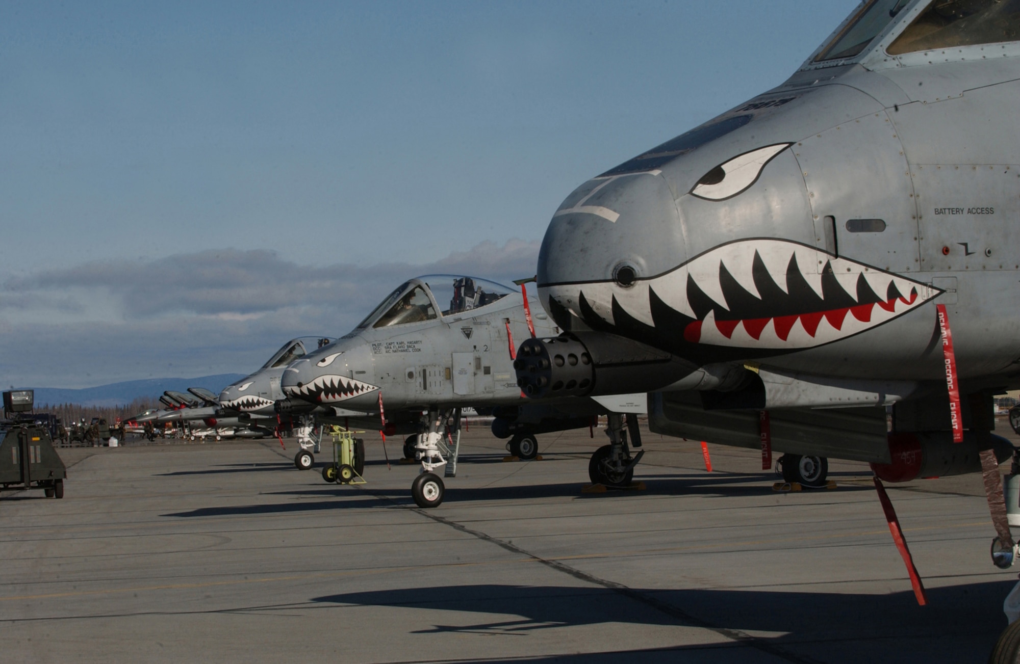 EIELSON AIR FORCE BASE, Alaska - A-10 Thunderbolt IIs from the 75th Fighter Squadron, Pope AFB, North Carolina,  have their game faces on, ready to take to the skies over the Pacific Alaskan Range Complex here during Red Flag - Alaska 06-2.  The "Warthogs" join B-52 Stratofortresses, F-16 Fighting Falcons, KC-10 Extenders, KC-135 Stratotankers and HH-60G Pave Hawks on the ramp here. (U.S. Air Force Photo by TSgt Julie Avey)                               