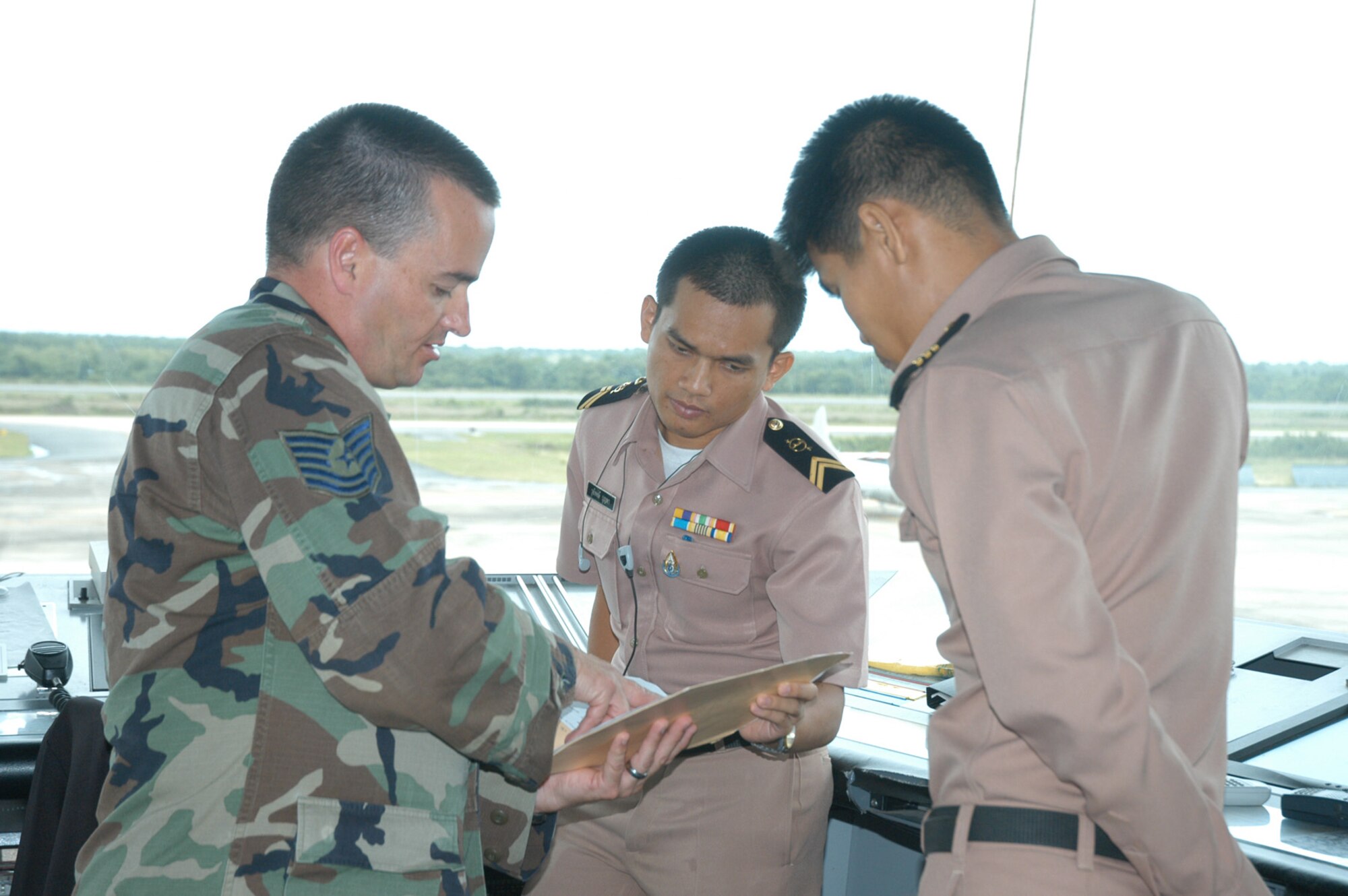 Technical Sgt. Roger Riddle, combat airspace manager, works closed with his Royal Thai Navy counterparts during Cobra Gold 2006.                         
