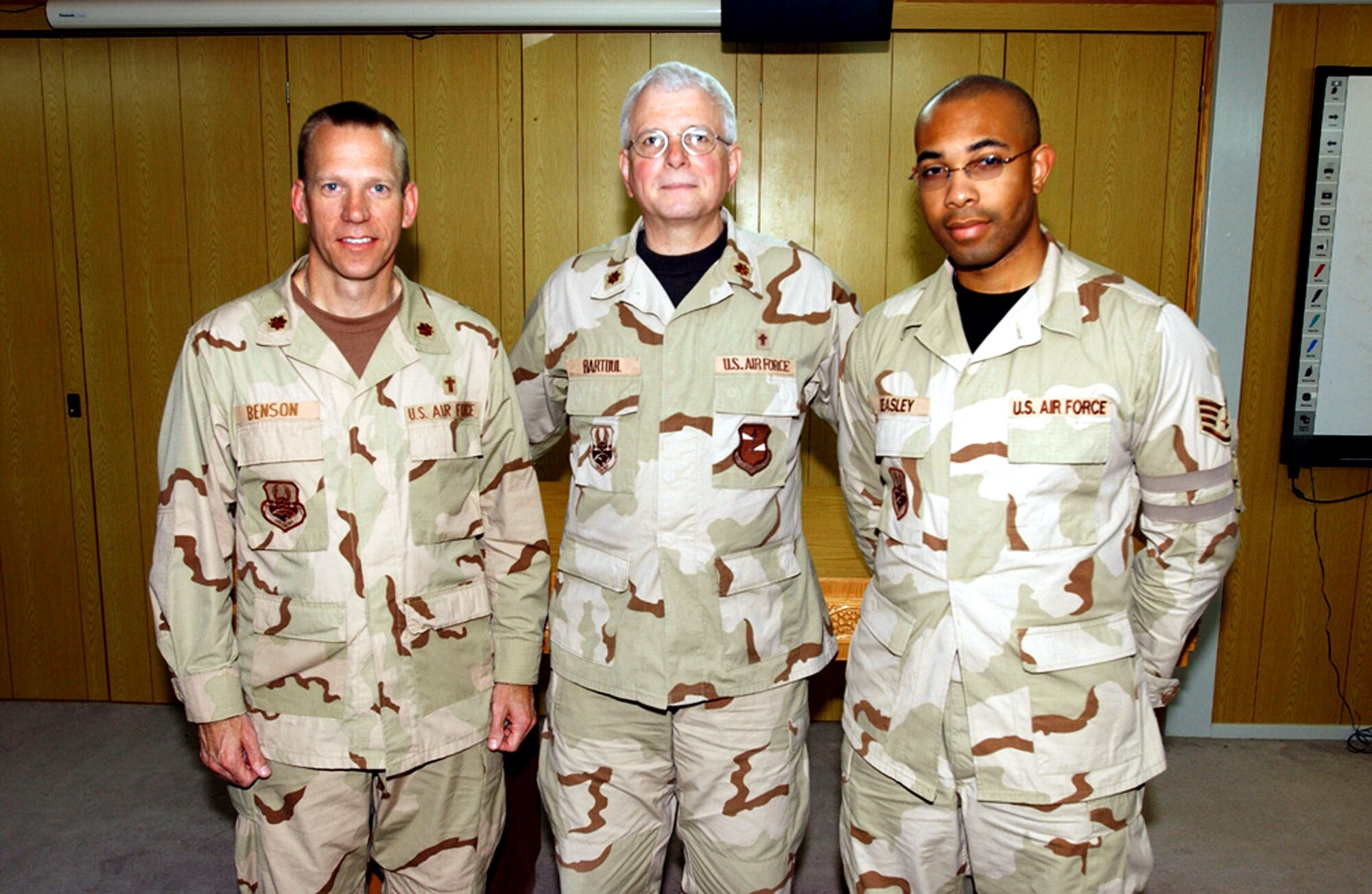 (From left) Chaplains (Maj.) Craig Benson and (Maj.) William Bartoul and Staff Sgt. Steven Beasley, chaplain assistant, are the base chapel team for the 380th Air Expeditionary Wing in Southwest Asia. (U.S. Air Force photo/Staff Sgt. Jason Webb)