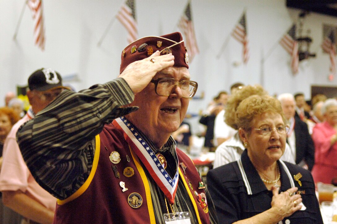 Everett Waldrum salutes during the playing of the National Anthem at the 2006 Former POW/Purple Heart Luncheon at Barksdale Air Force Base, La., on Saturday, May 20, 2006.  Eighty-two former prisoners of war and 250 Purple Heart recipients attended the luncheon.  Lt. Gen. Kevin P. Chilton, 8th Air Force commander, was the keynote speaker.  Mr. Waldrum, a former Marine Corps platoon sergeant, was a POW during World War II. (U.S. Air Force photo/Master Sgt. Michael A. Kaplan) 