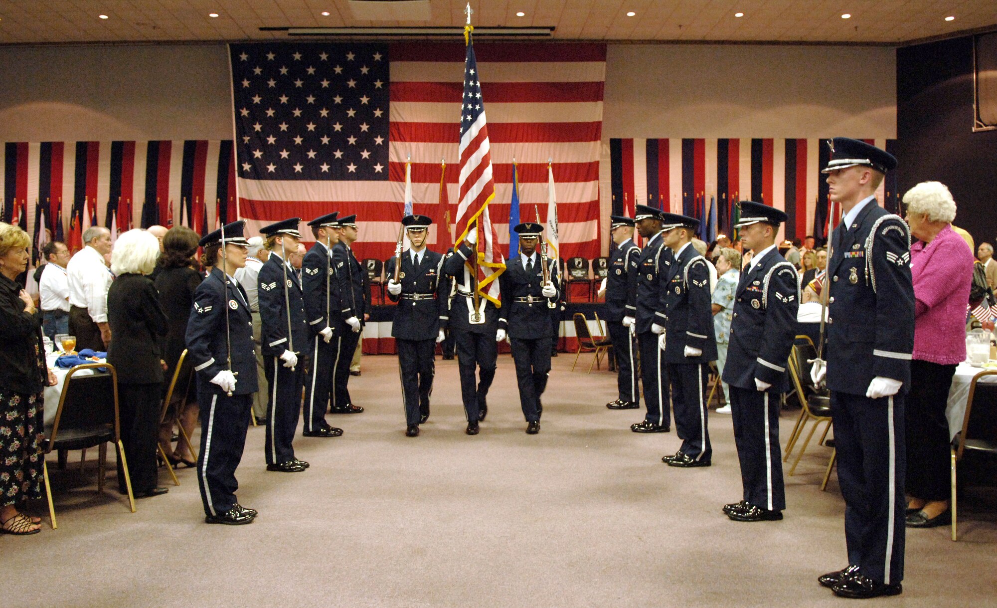 The honor guard retires the colors at the 2006 Former POW/Purple Heart Luncheon at Barksdale Air Force Base, La., on Saturday, May 20, 2006.  Eighty-two former prisoners of war and 250 Purple Heart recipients attended.  The keynote speaker was Lt. Gen. Kevin P. Chilton, 8th Air Force commander.  (U.S. Air Force photo/Master Sgt. Michael A. Kaplan) 
