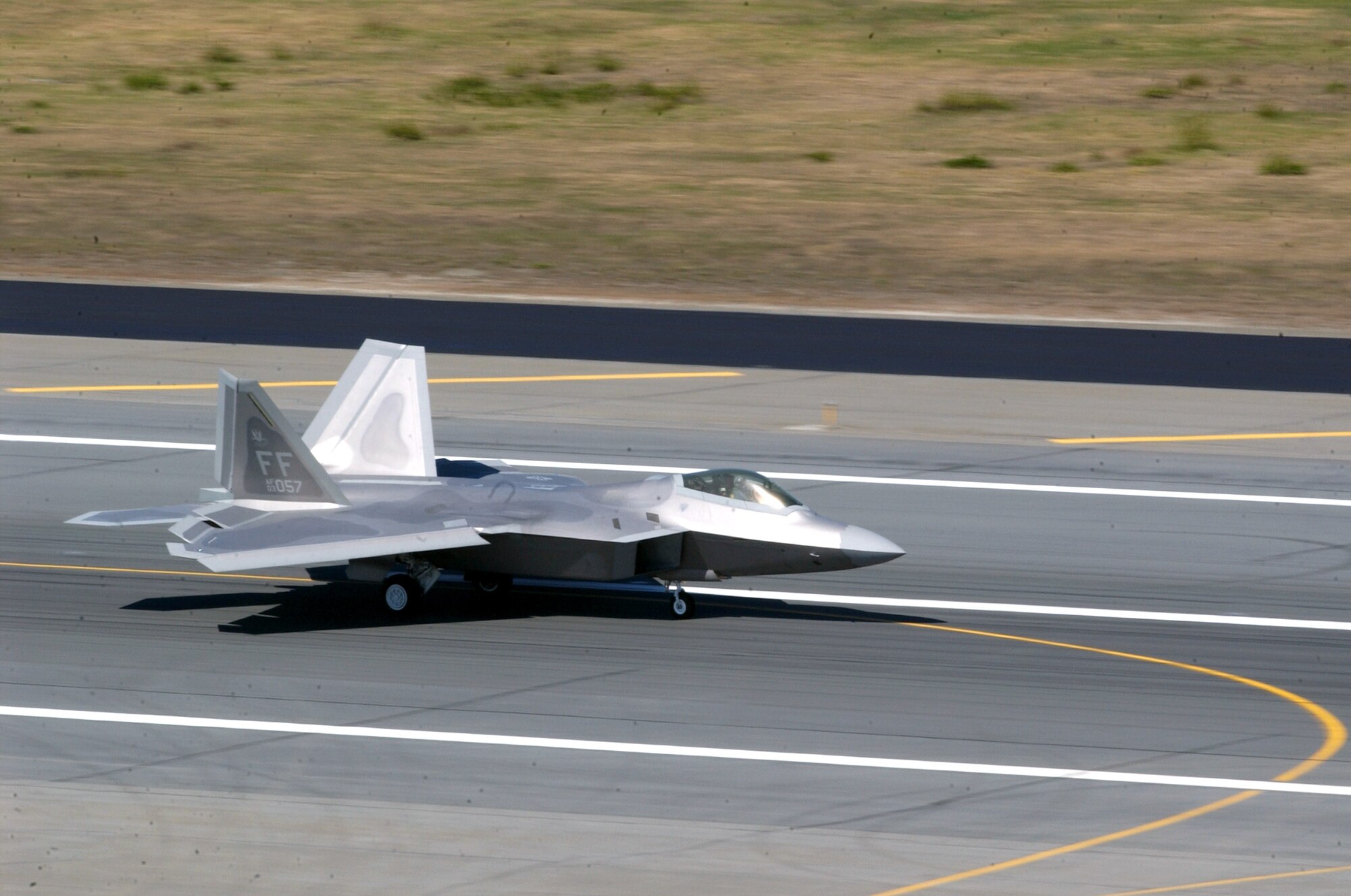 An F-22 Raptor taxis after landing at Elmendorf Air Force Base, Alaska, on Tuesday, May 23, 2006. Raptors from the 27th Fighter Squadron at Langley AFB, Va., are supporting Exercise Northern Edge 2006. The Air Force has selected Elmendorf as the home for the next operational F-22 squadron. The base will receive 36 Raptors, with the first jet expected in fall 2007. (U.S. Air Force photo/Staff Sgt. Dave Donovan) 