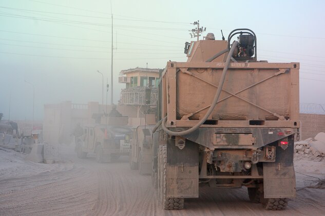 During a recent major re-supply mission May 24, 2006 to entry control points and forward operating bases in and around the city of Fallujah, Marines with Combat Logistics Company 115, Combat Logistics Battalion 5, provided support to American service members on the frontlines of operations in the area. The company, along with the rest of Combat Logistics Battalion 5, serves as a logistical support unit in the Al Anbar Province, supporting American and Iraqi forces operating here. On major re-supply convoys such as this one CLC 115 will deliver food, water, fuel and other equipment or supplies to multiple locations in one trip outside the security of Camp Fallujah.