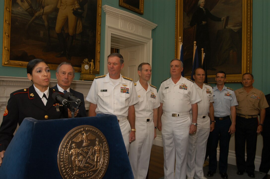 NEW YORK CITY -- Cpl. Elizabeth A. Quinones, sings the National Anthem at the Mayoral welcome at City Hall, May 26. Quinones described singing as "A little nerve wrecking, But you never let them see you sweat," she said. New York Mayor, Michael Bloomberg, welcomed United States troops to the 19th annual Fleet Week held here. Fleet Week is a week long celebration commemorating the United states military. ::n::::n::Photo by Petty Officer 3rd Class Kyle Mc Cloud.