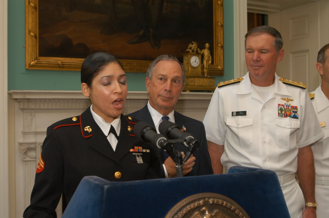 NEW YORK CITY -- Cpl. Elizabeth A. Quinones, sings the National Anthem at the Mayoral welcome at City Hall, May 26. Quinones described singing as "A little nerve wrecking, But you never let them see you sweat," she said. New York Mayor, Michael Bloomberg, welcomed United States troops to the 19th annual Fleet Week held here. Fleet Week is a week long celebration commemorating the United states military. ::n::::n::Photo by Petty Officer 3rd Class Kyle Mc Cloud.