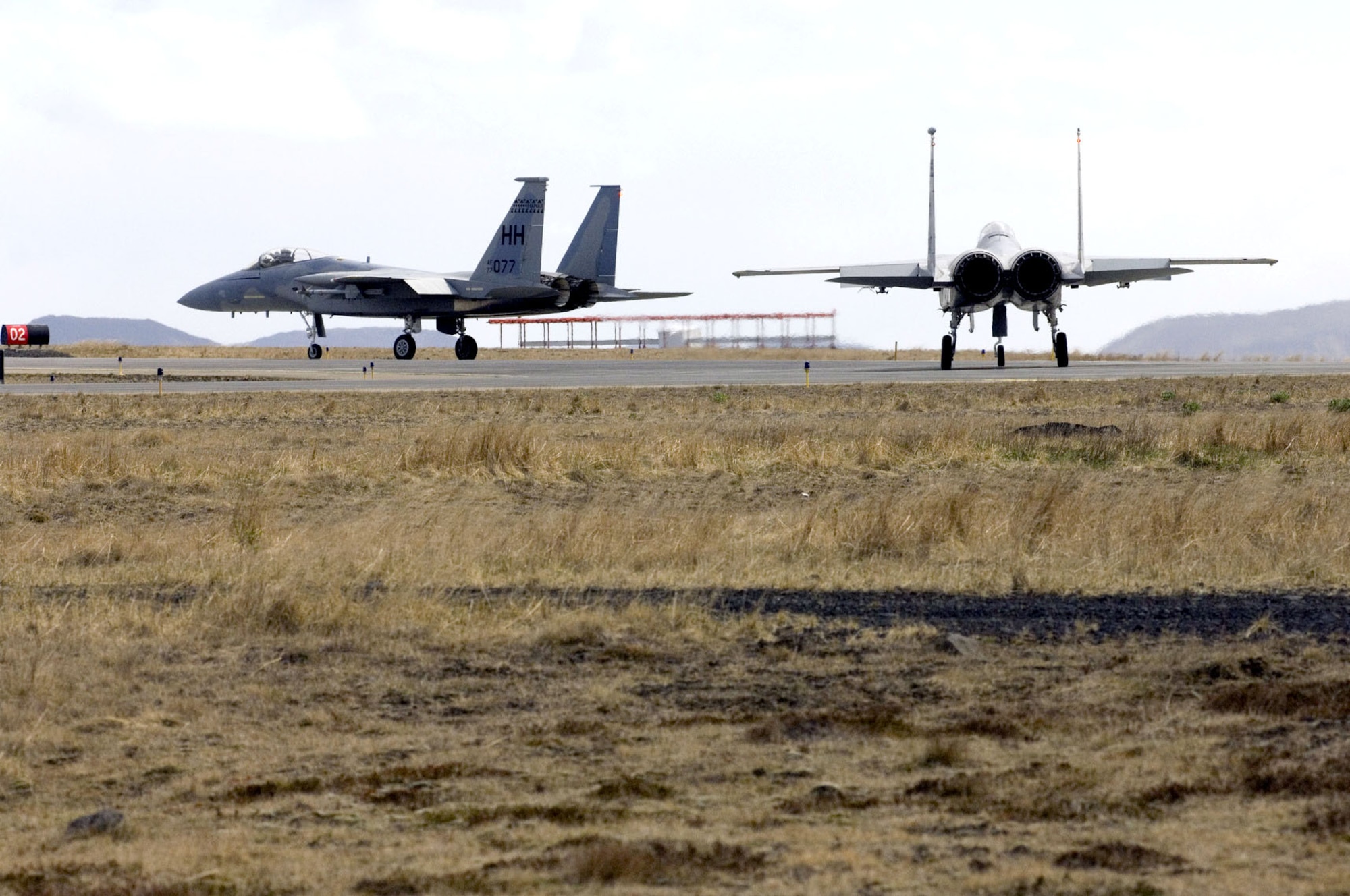 F-15 Eagles wait to take off from Naval Air Station Keflavik, Iceland, on Monday, May 22, 2006. Airmen and Sailors are reducing operations after more than 50 years of U.S. presence at the base. The F-15s and crews are from the Hawaii Air National Guard's 154th Fighter Wing at Hickam Air Force Base. (U.S. Air Force photo/Master Sgt. John E. Lasky) 