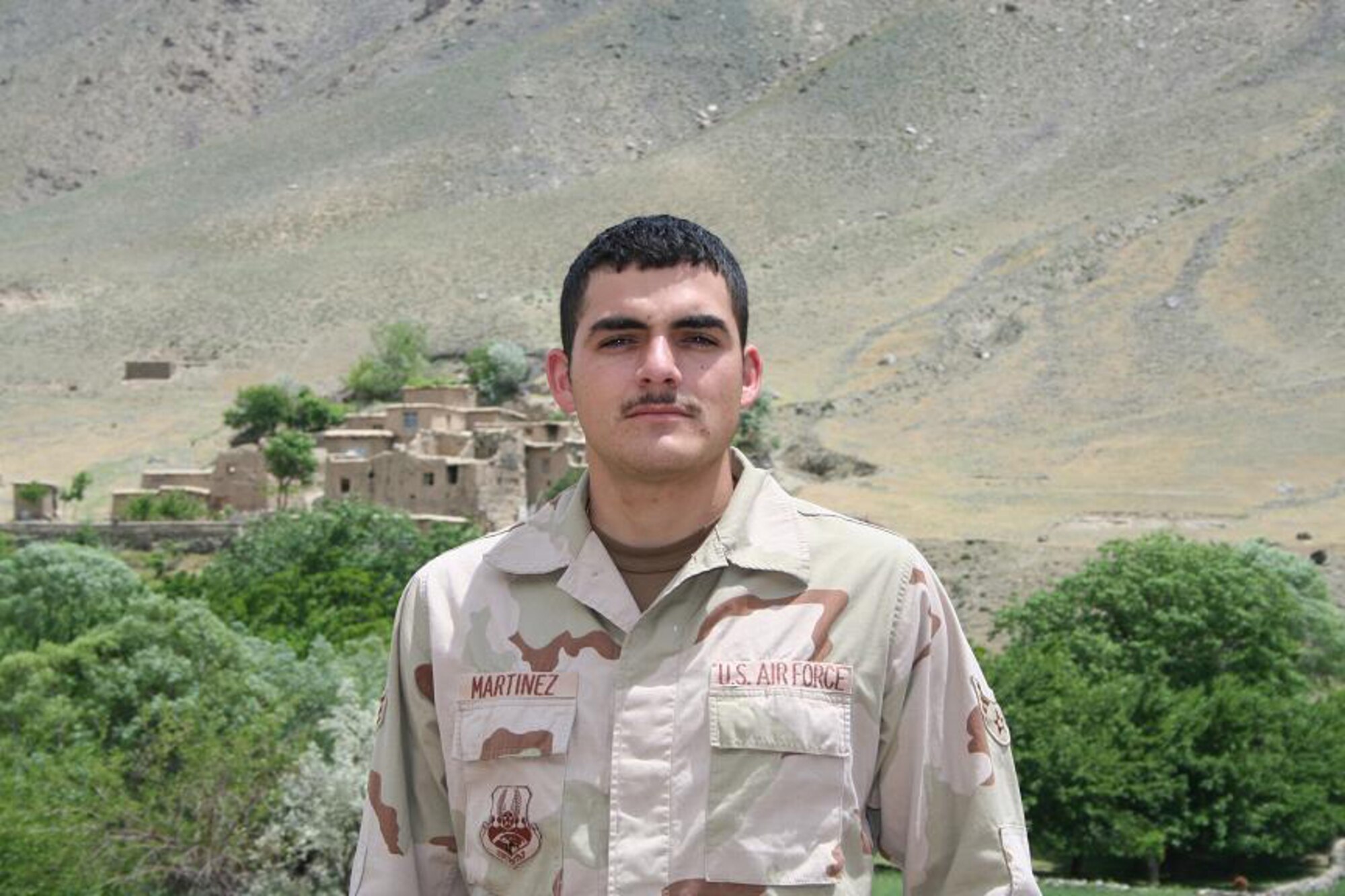 Senior Airman Dennis Martinez, a communications technician stationed at Tinker Air Force Base near Oklahoma City, is deployed as a member of the Provincial Reconstruction Team based in the Panjshir Valley in Afghanistan. He came to the aid of an Afghan boy injured in a bus accident May 11. (Photo by Technical Sgt. John Cumper).