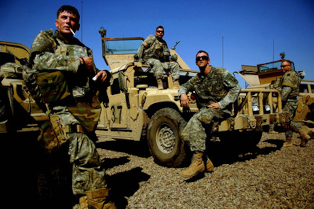 Soldiers take a break in a secure area before heading back out on their eight-hour patrol of the streets of Ameriah, a suburb of Baghdad, Iraq, on May 21, 2006. The soldiers are from Alpha Company, 1st Battalion, 87th Infantry Regiment, 10th Mountain Division, Fort Drum, N.Y. 